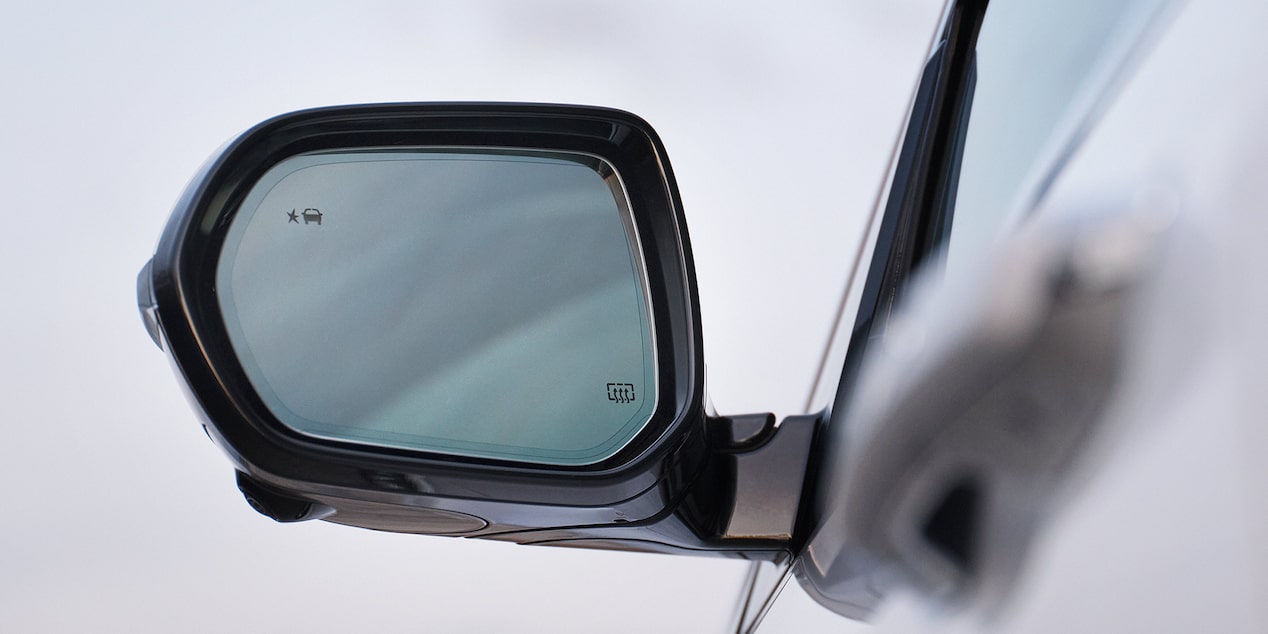 Close-up of the Drives Side Side-View Mirror on a Buick Vehicle