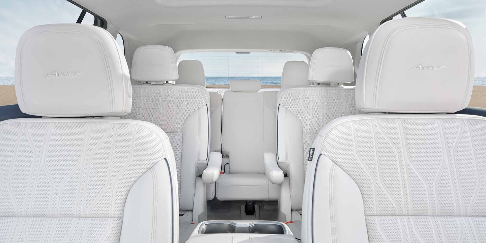 Interior View of the 3-Rows of White Leather Seats in a Buick SUV