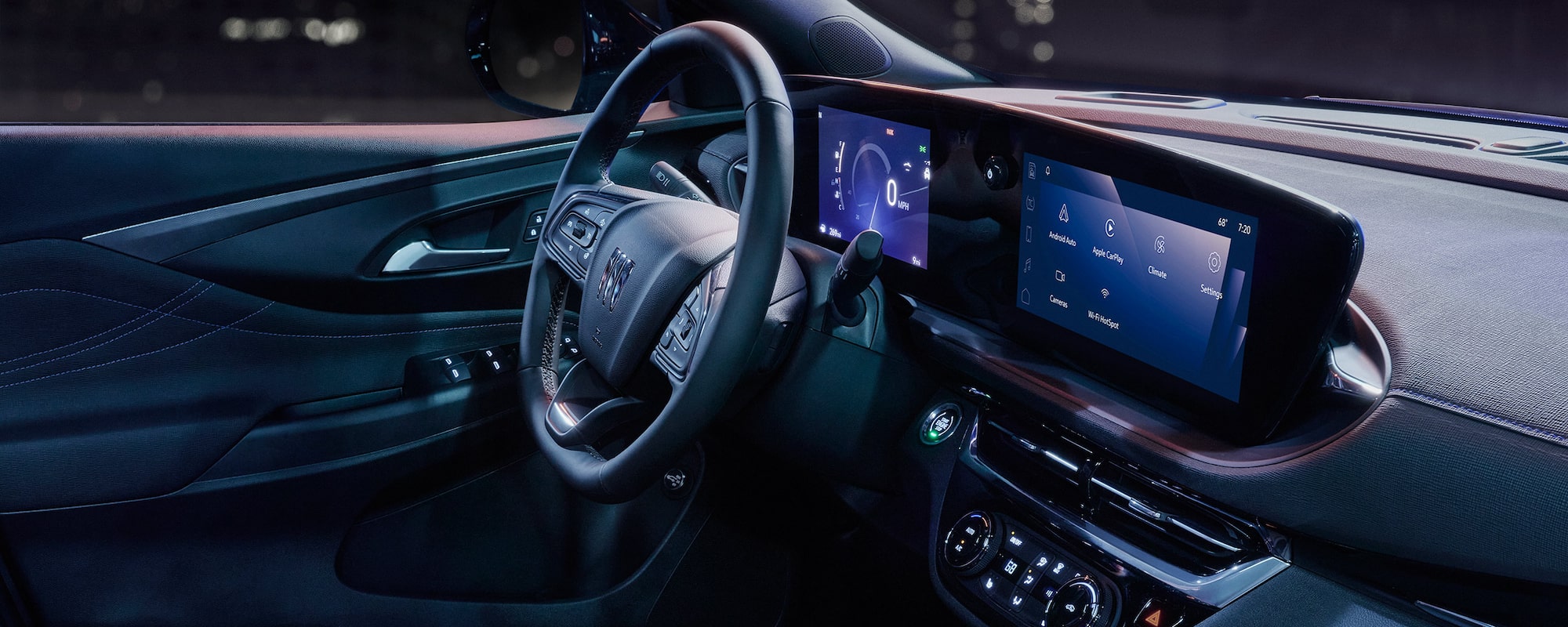 Interior View of a Buick Vehicles Steering Wheel, Infotainment System, and Center Console