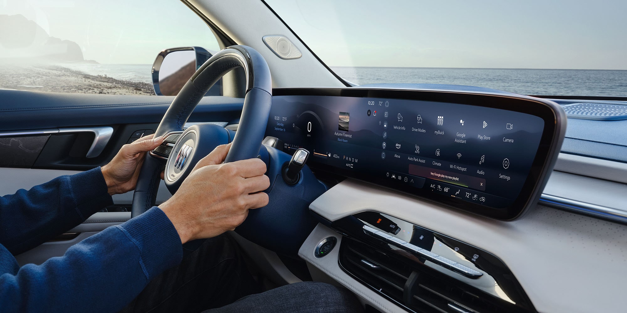 Interior View of the Infotainment System and a Man Holding the Steering Wheel in a Buick SUV