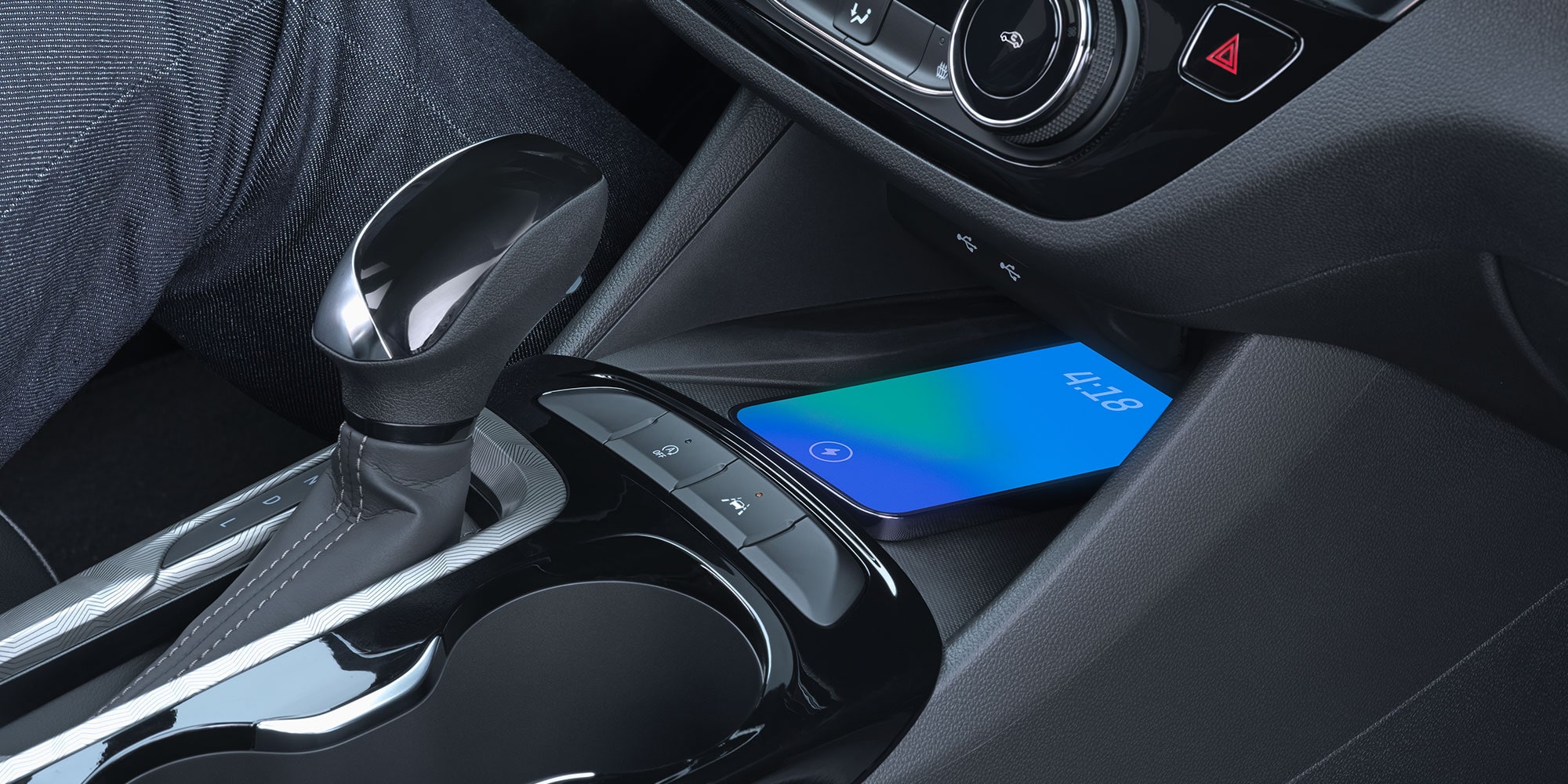 Close-up of a Smartphone Charging on the Wireless Charger in the Buick Envista