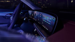Interior View of the Steering Wheel and Infotainment Screen in the Buick Enclave Lite up at Night