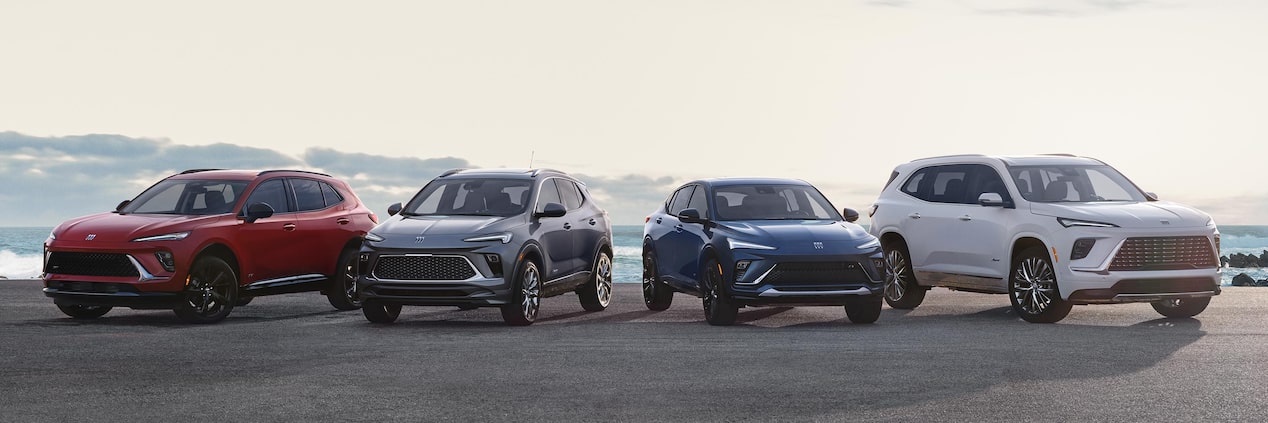The Buick Lineup Parked Near a Body of Water on a Sunny Day
