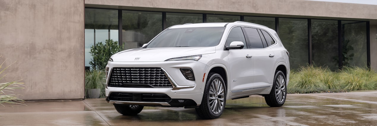 The Buick Enclave Parked in the Driveway of a Modern House
