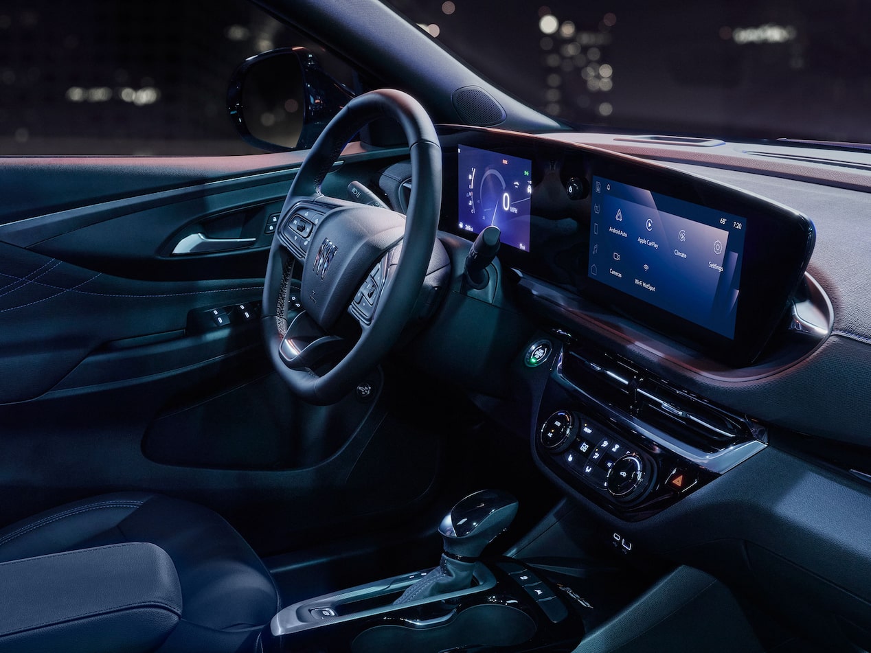Buick Envista Interior with a Steering Wheel and Two Large Digital Displays Showing Information and Apps