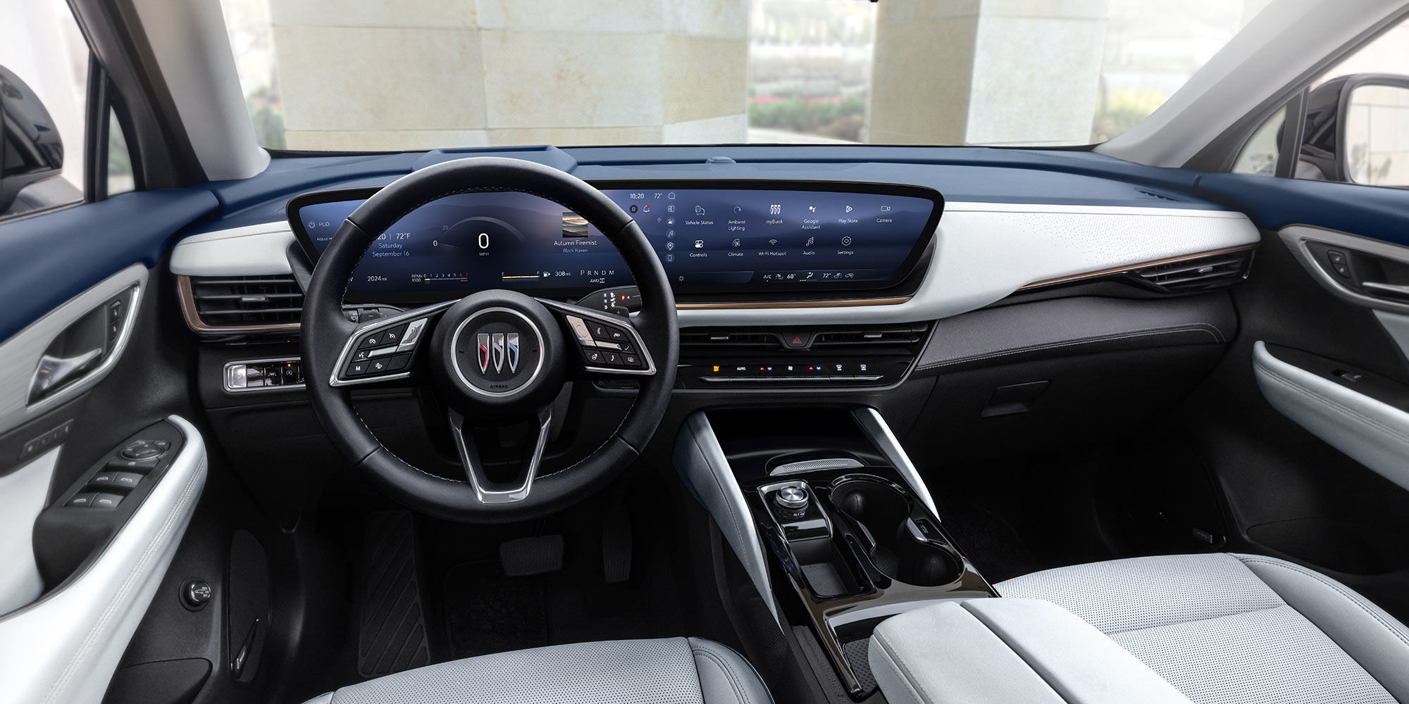 Buick Vehicle Interior with a Wide Digital Display and Light Gray Seats