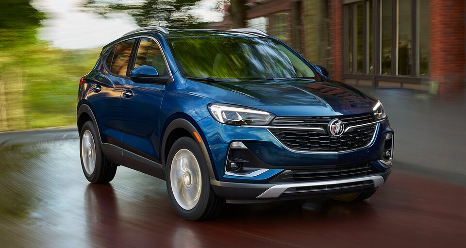 The Saphire Metallic Buick Encore GX Speeding Through a Neighborhood