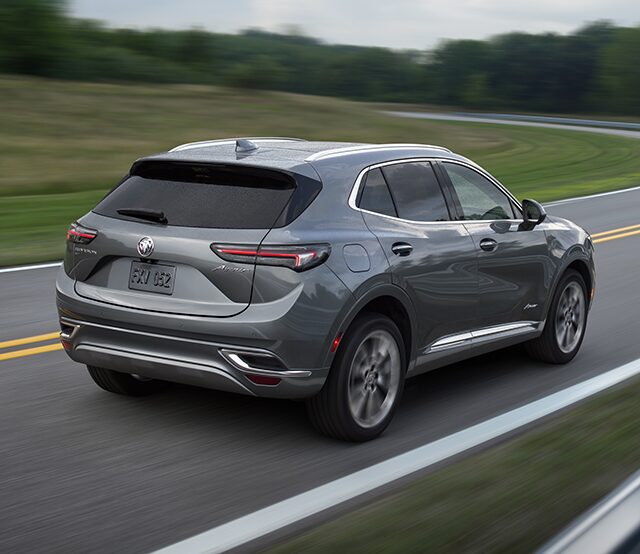 A Buick SUV Speeding on an Open Country Road