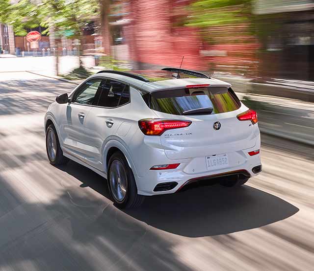 A Buick SUV Zipping Through Downtown