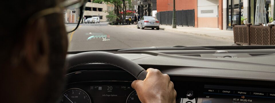 A Man Uses His Buick SUV's Heads-Up Display