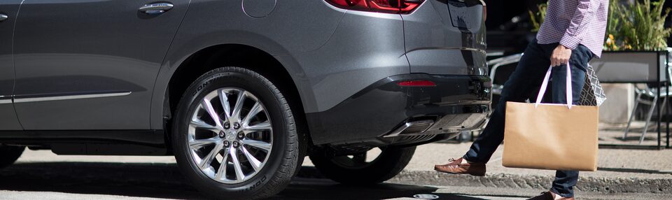 Man Using Hands Free Power Liftgate After Shopping Using his My Buick Rewards Master Card