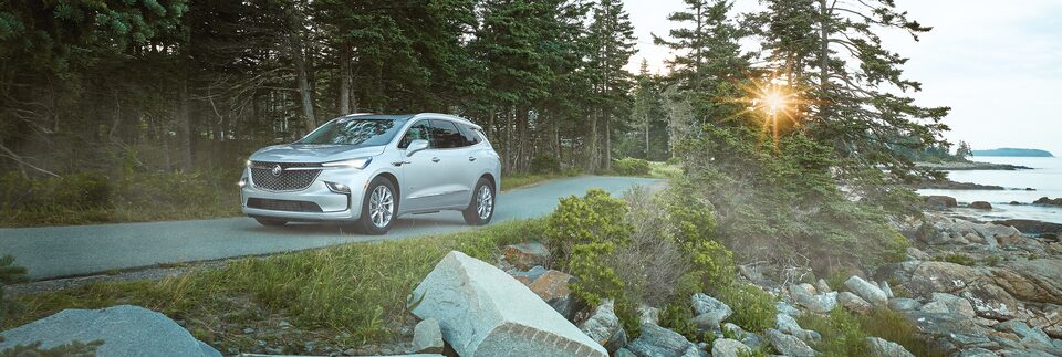 Buick Envision Driving by Lake