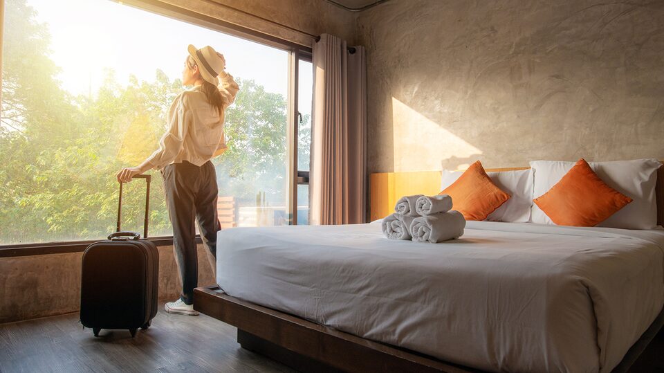 Woman Booking a Hotel Room Using My Buick Rewards