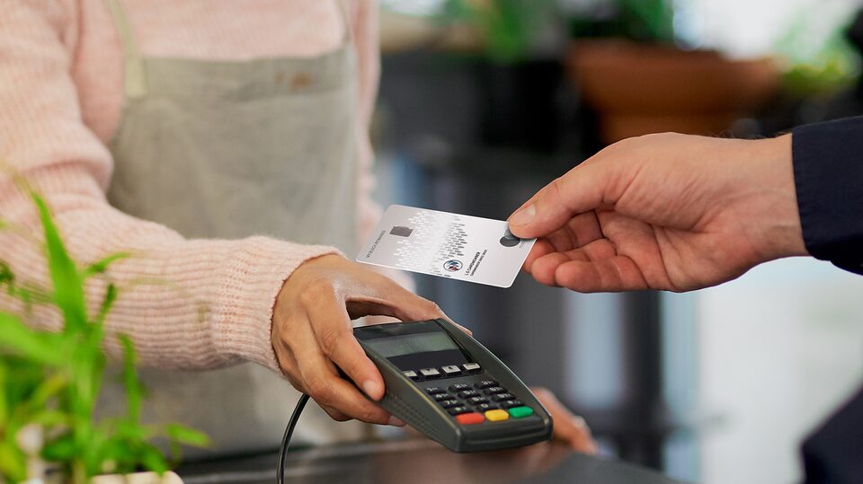 Man Using His My Buick Rewards Card at Coffee Shop to Earn Points