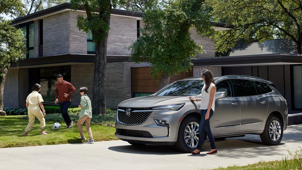 Family Going into Buick Vehicle