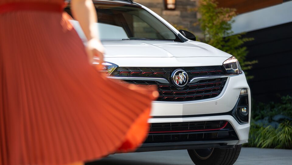Woman Walking Up to Her Buick Envision