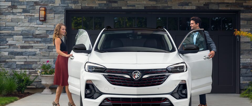 Women Walking Past Parked Buick Encore