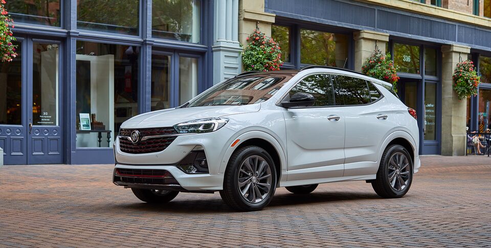 2021 Buick Encore: Small SUV Three-Quarter Front Drivers Side View Parked By Snow Covered Mountains