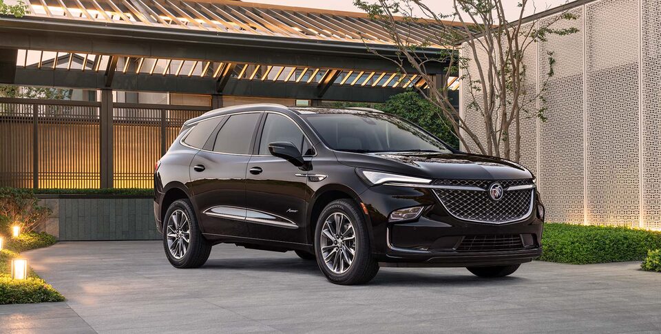 2021 Buick Enclave Front Three-Quarters View Parked near Snow Covered Mountains