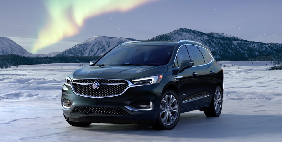 2021 Buick Enclave Front Three-Quarters View Parked near Snow Covered Mountains