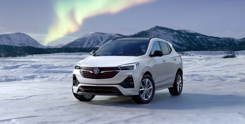 2021 Buick Encore: Small SUV Three-Quarter Front Drivers Side View Parked By Snow Covered Mountains