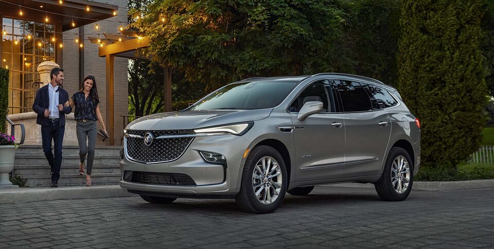2021 Buick Enclave Front Three-Quarters View Parked near Snow Covered Mountains