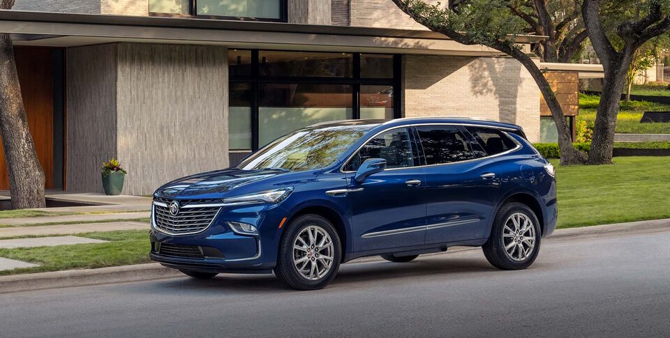2021 Buick Enclave Front Three-Quarters View Parked near Snow Covered Mountains