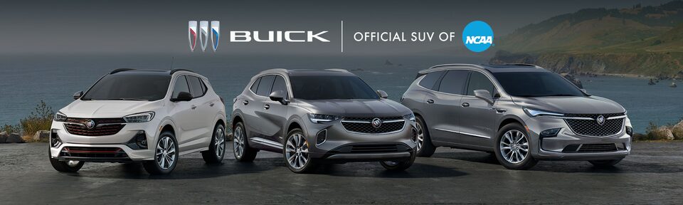 The Buick Vehcile Lineup Parked on Snow with Mountains and a Aurora in Background