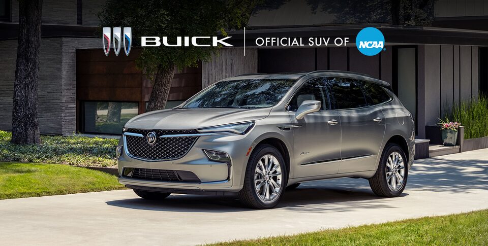The Buick Enclave ST Parked In a Driveway next to a House