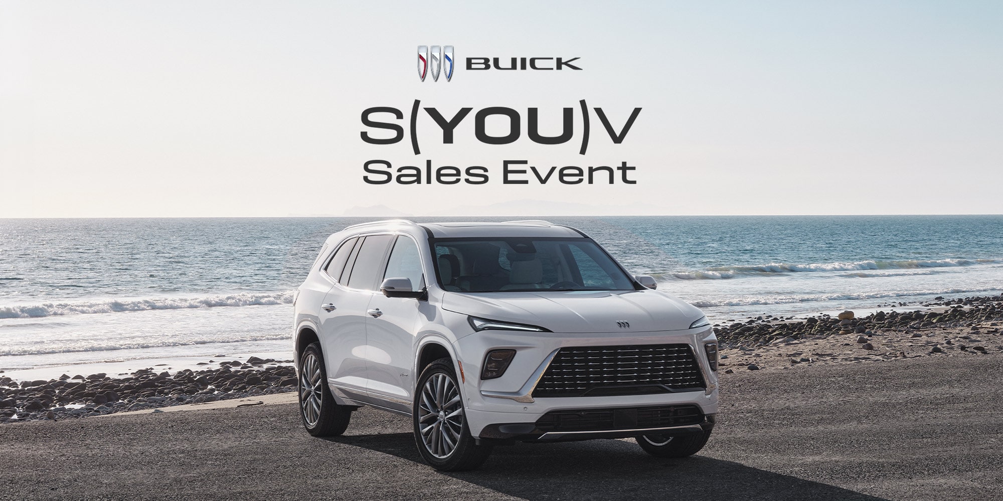 White Buick Enclave with S(YOU)V Sales Event Logo