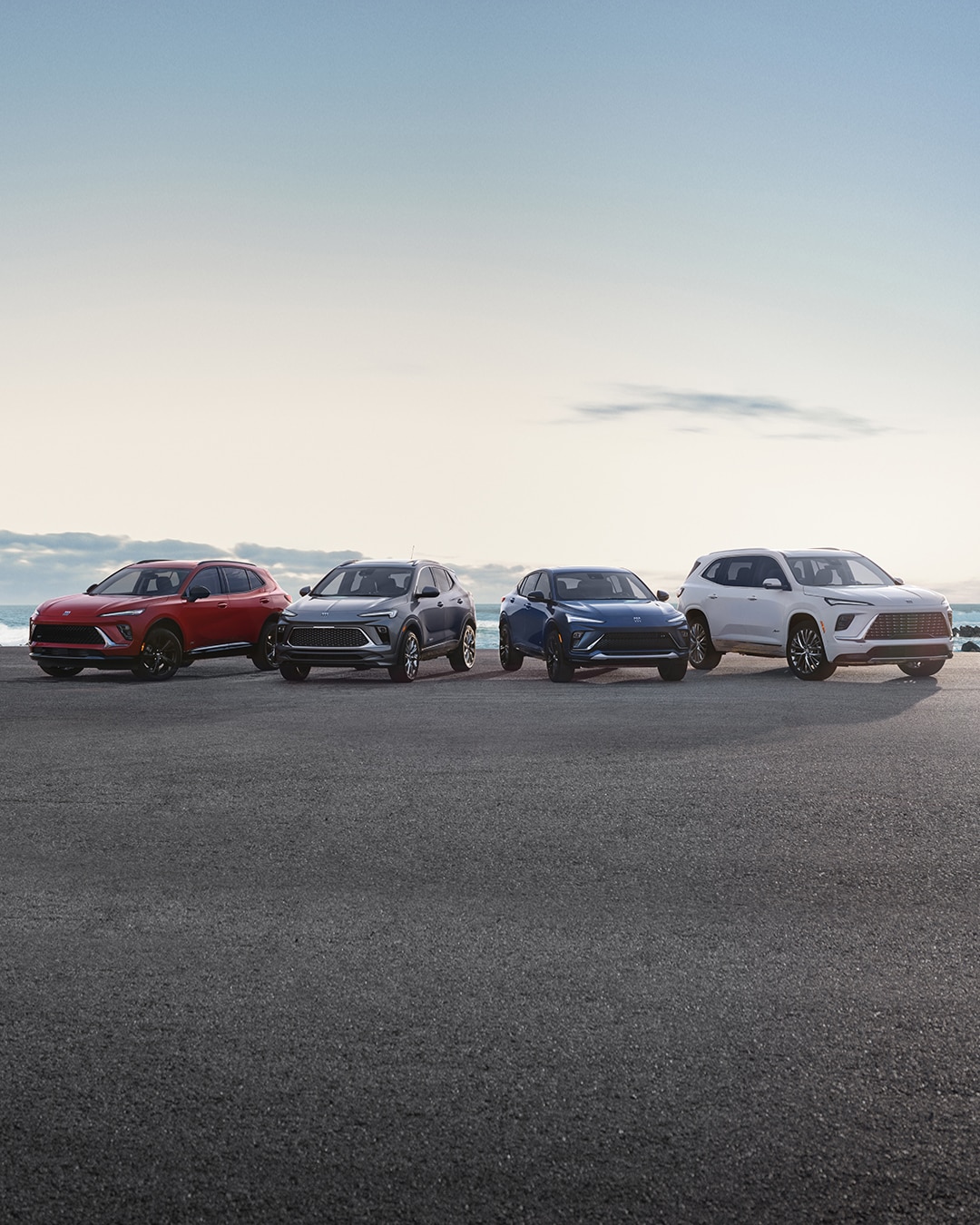 Lineup of Buick Vehicles parked with Ocean in the background