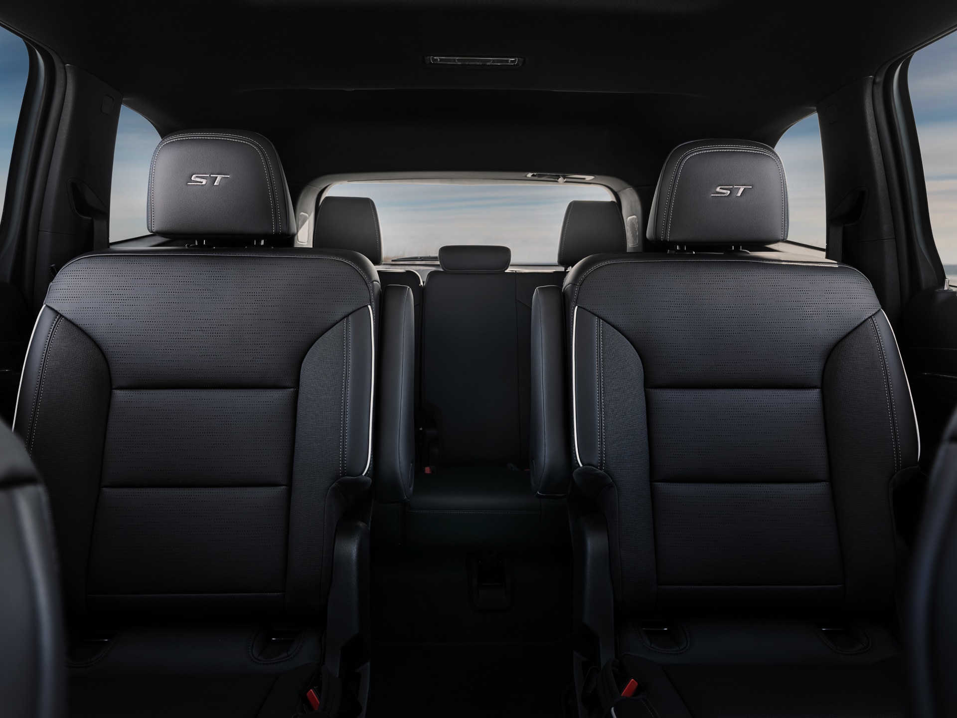 The Interior of a Buick Vehicle Showing the Rear Row Seating With ST Logos