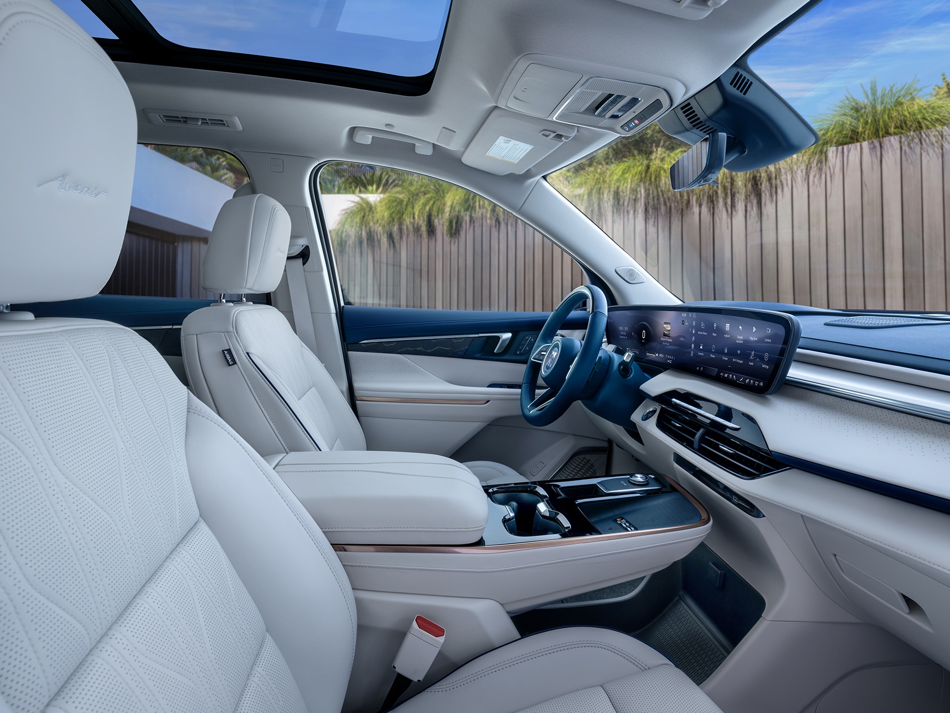 An Interior View of the White Rear Seats in a Buick Enclave with a Panoramic Sunroof