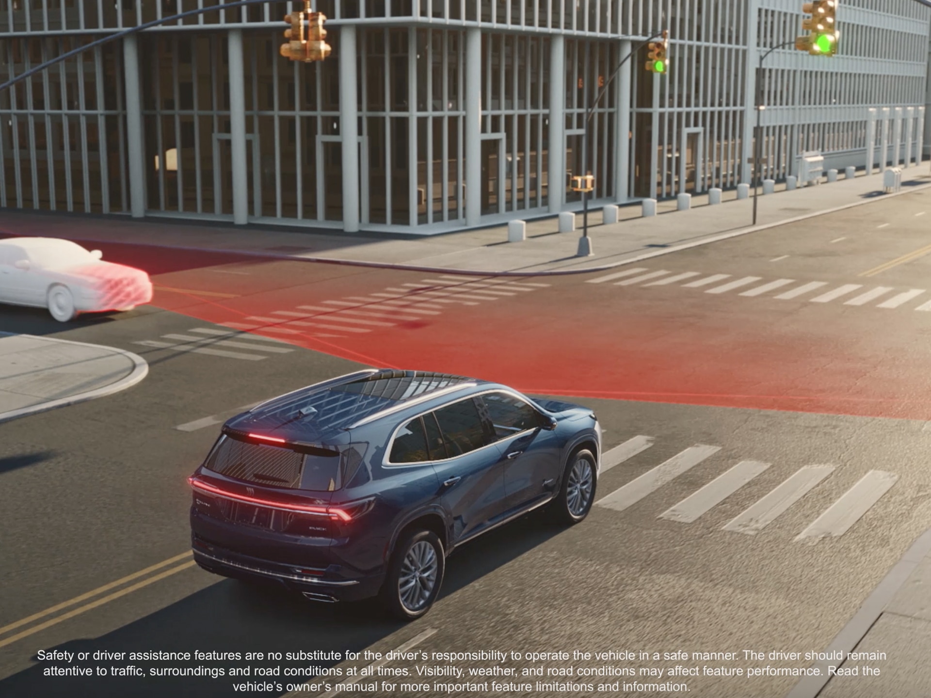 An Aerial View of a Dark Blue Buick Enclave SUV Turning at an Intersection With Red Safety Lines Indicating an Alert