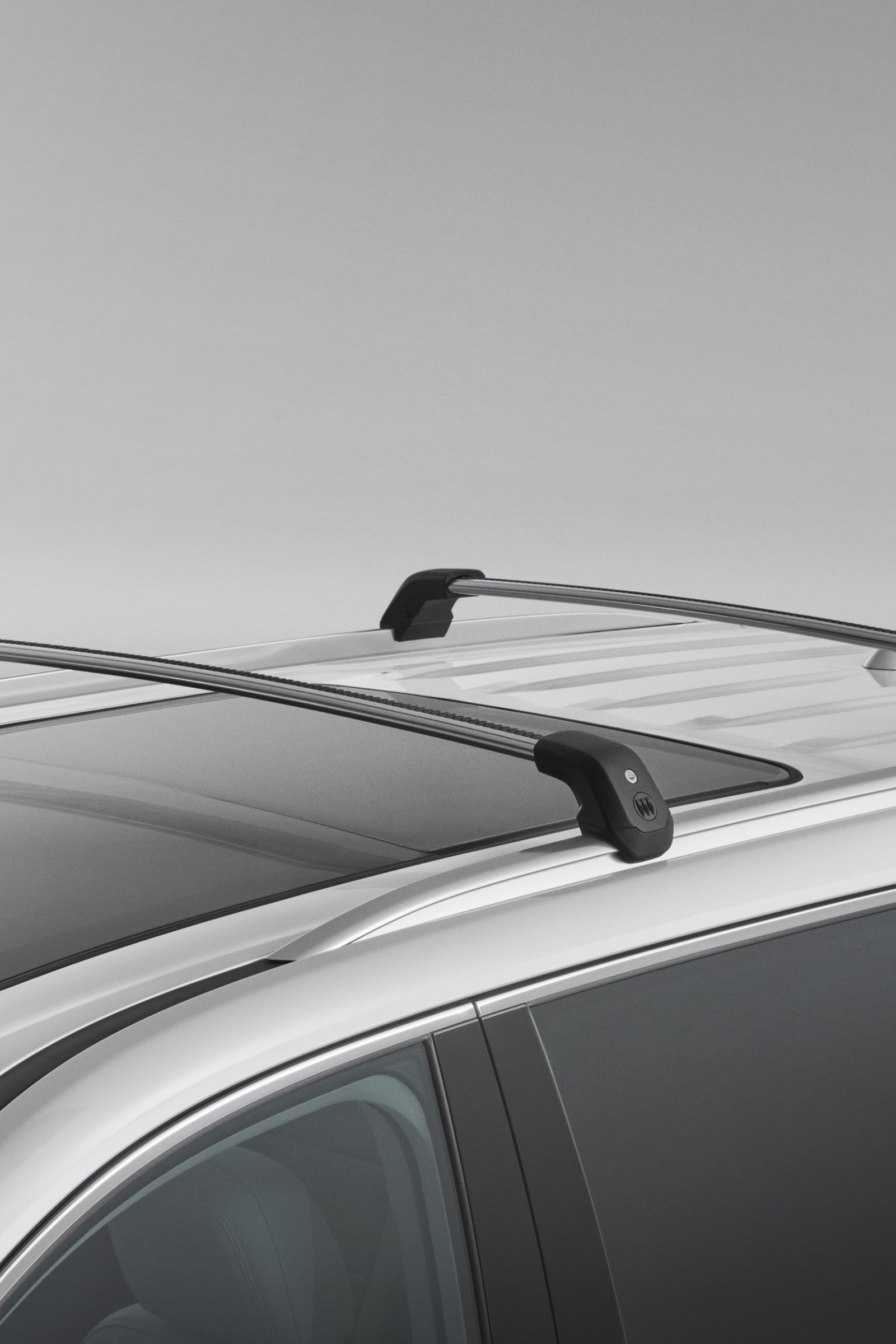 Black Roof Racks Installed on the Top of a Silver Buick SUV