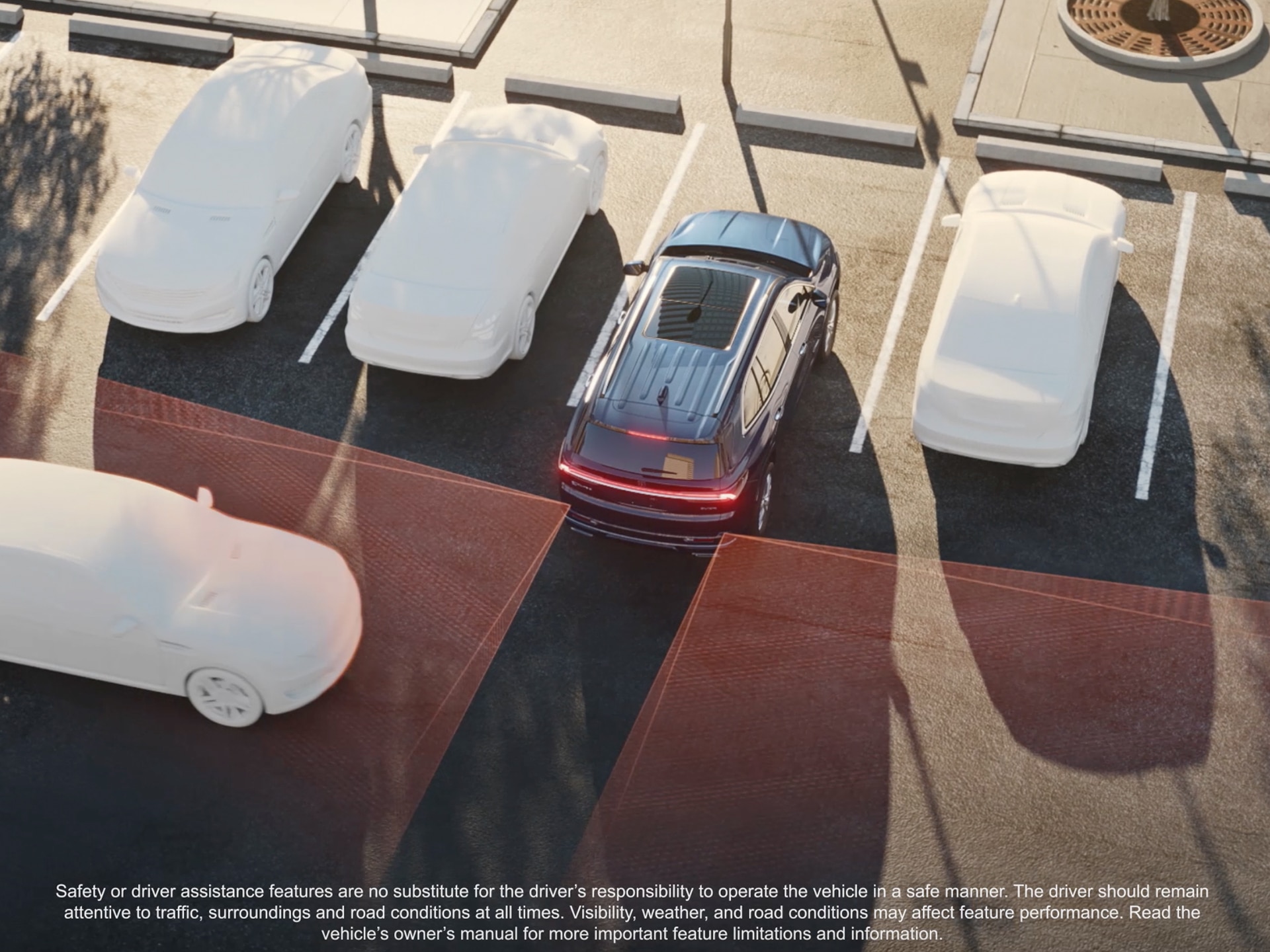 An Overhead View of a Dark Blue Buick Enclave SUV Backing Into a Parking Space With Red Safety Lines Indicating a Cross-Traffic Alert And Other Cars