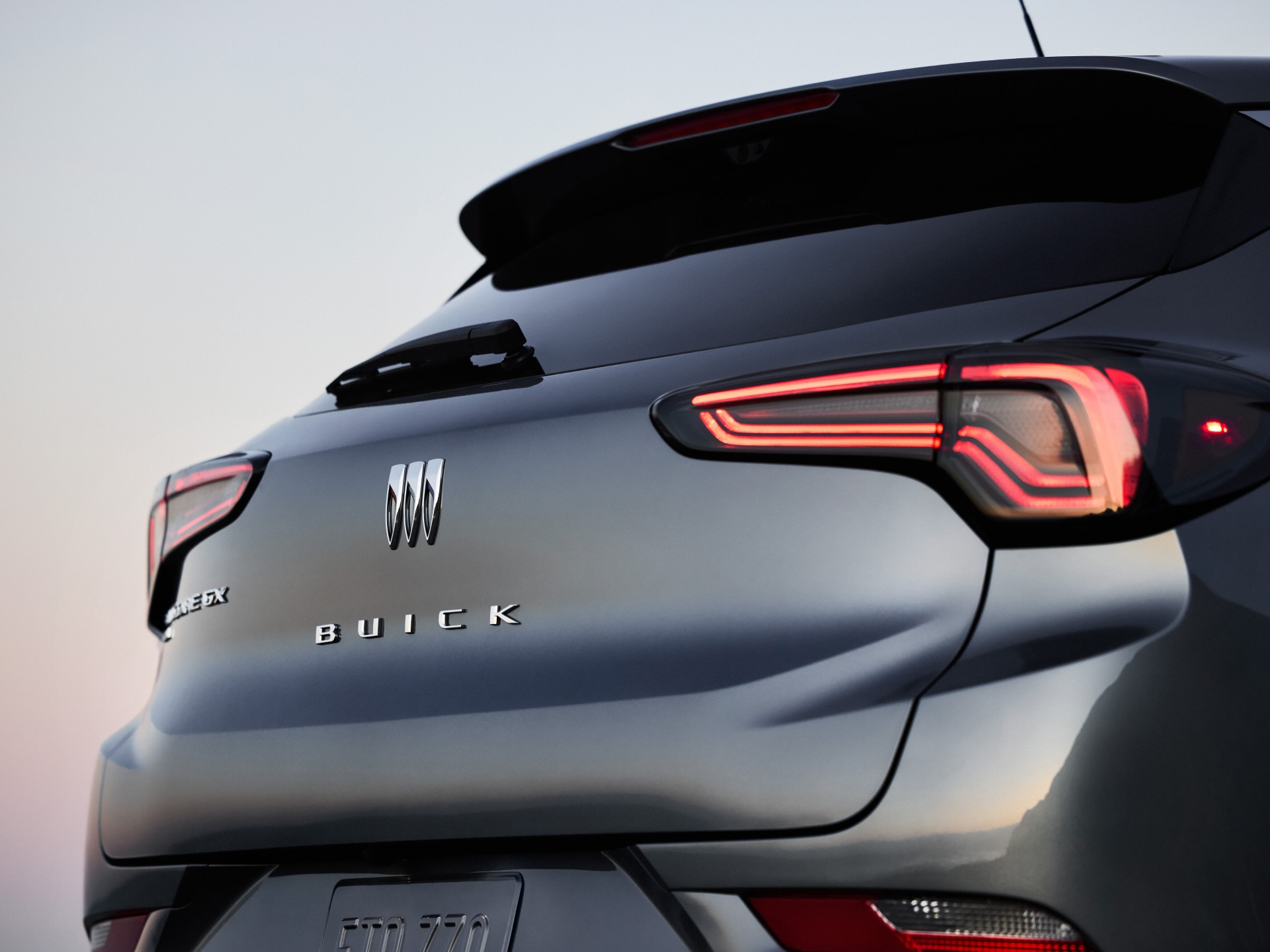 Rear View of a Gray Buick Encore GX Showing the Taillight and Buick Logo