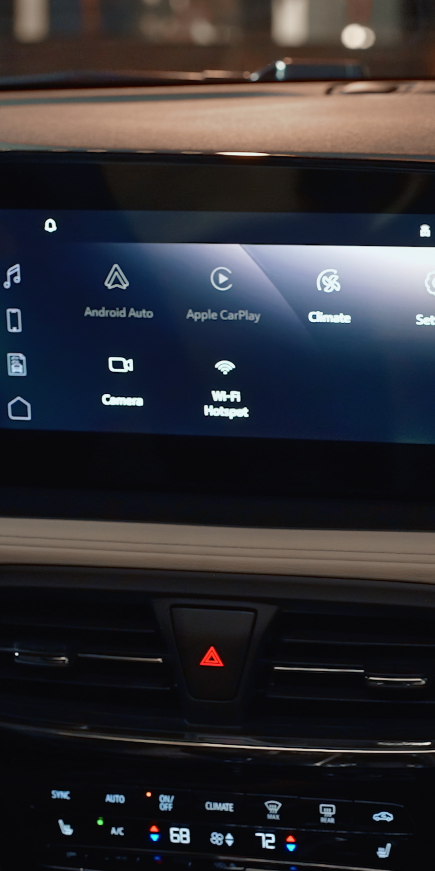 The Interior Dashboard of a Buick Vehicle Showing a Touchscreen Display with Options for "Android Auto", "Apple Carplay", "Climate", and "Settings" with Text "Technology"