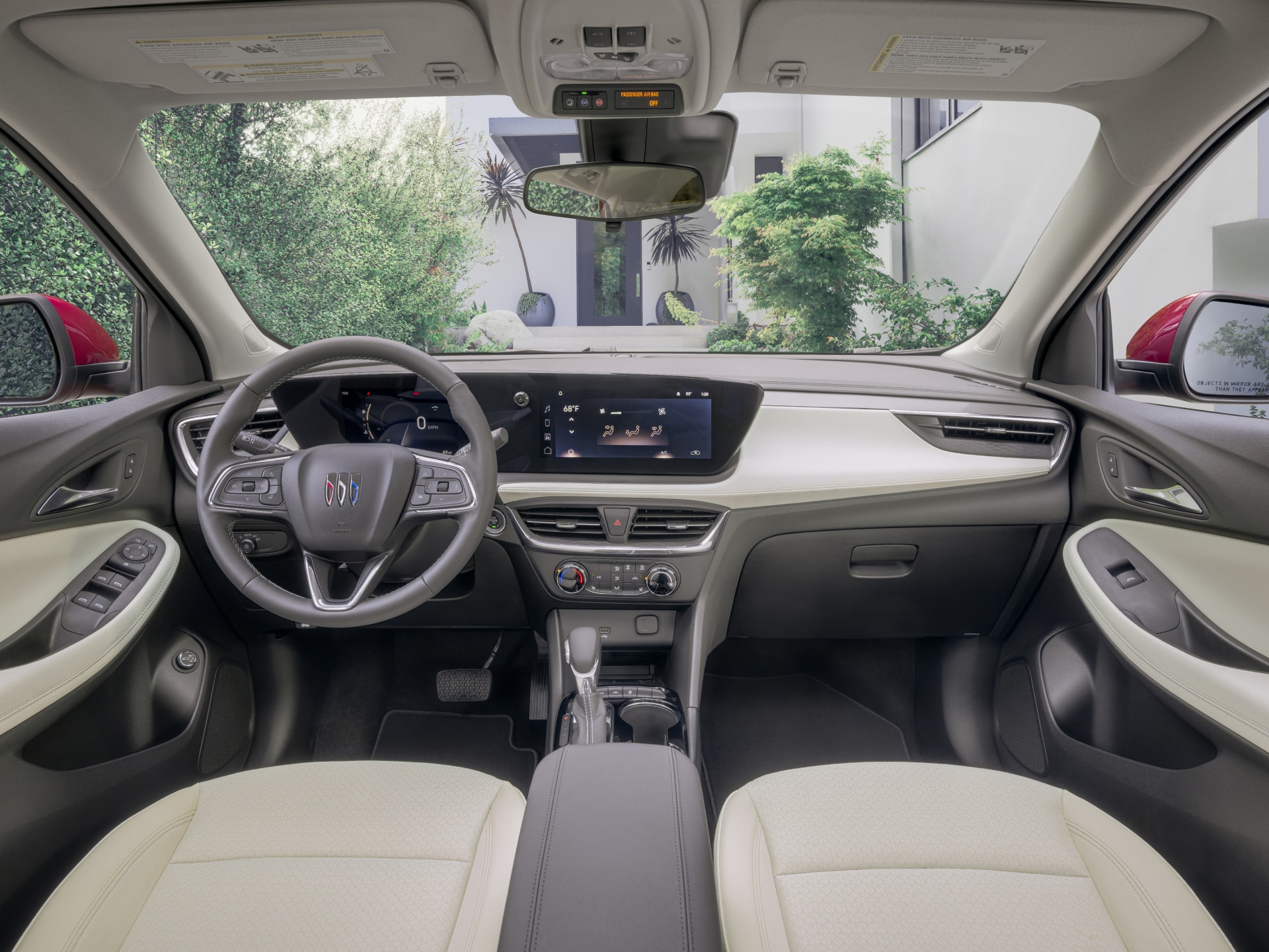 A Wide View of the Buick Interior Front Cabin with a Dashboard, Steering Wheel, and Ocean View