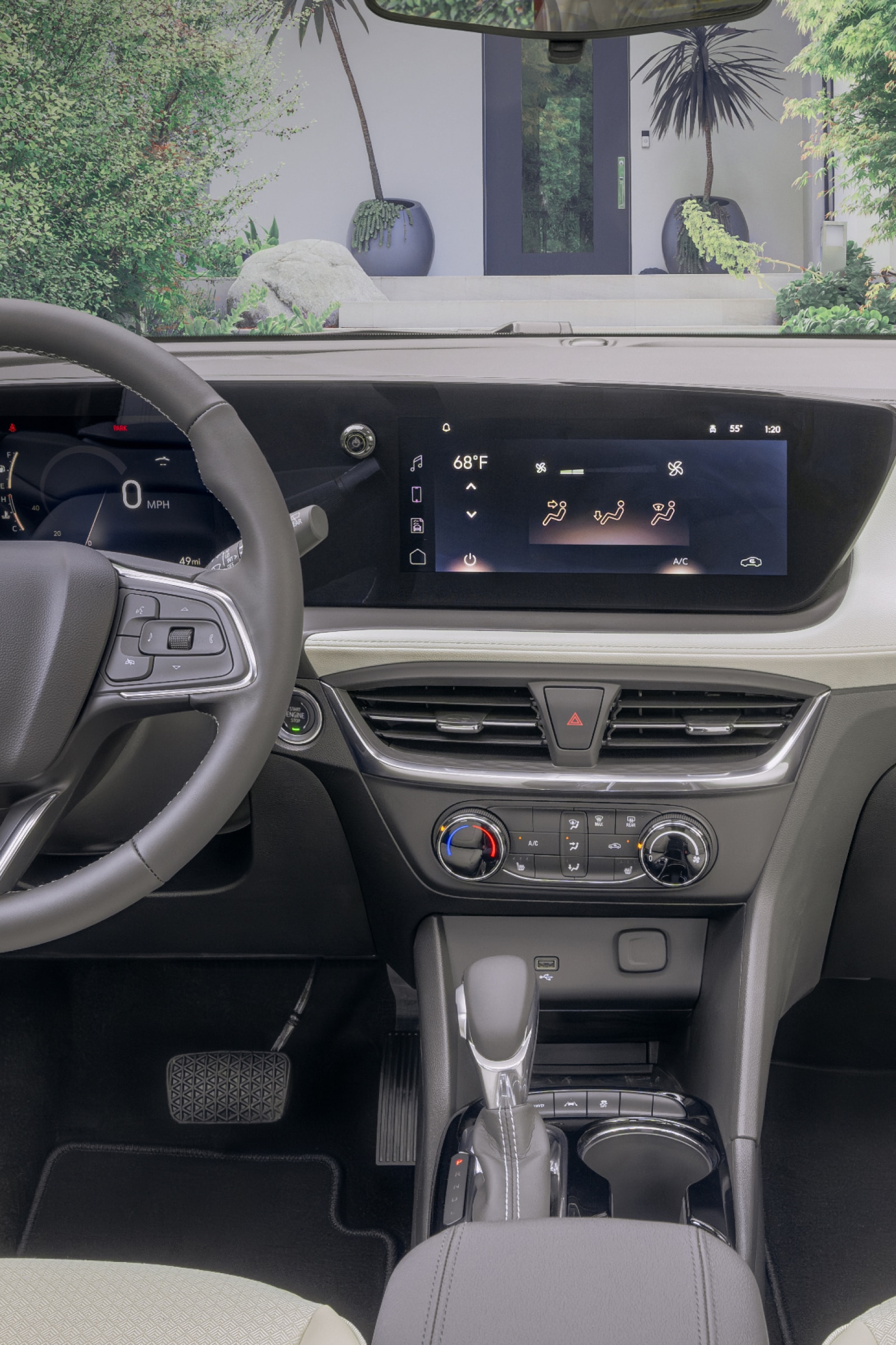 A Wide View of the Buick Interior Front Cabin with a Dashboard, Steering Wheel, and Ocean View