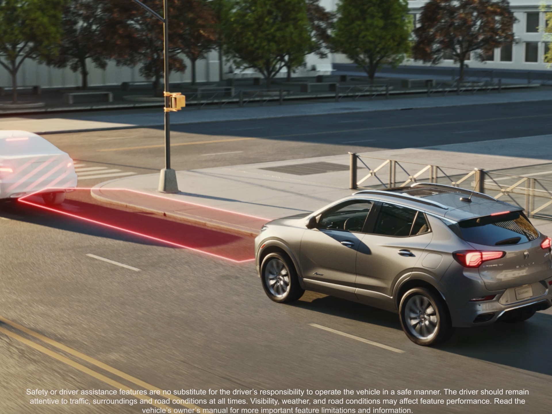 A Gray Buick Encore Gx Suv Driving on a City Street, with a Red Alert Area Indicating a Forward Collision Warning