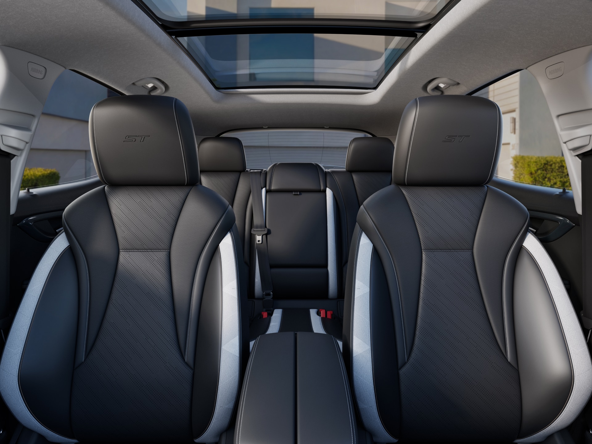 View Inside the 2027 Buick Envision Showing the Panoramic Sunroof and Second-Row Seats with Black and White Trim