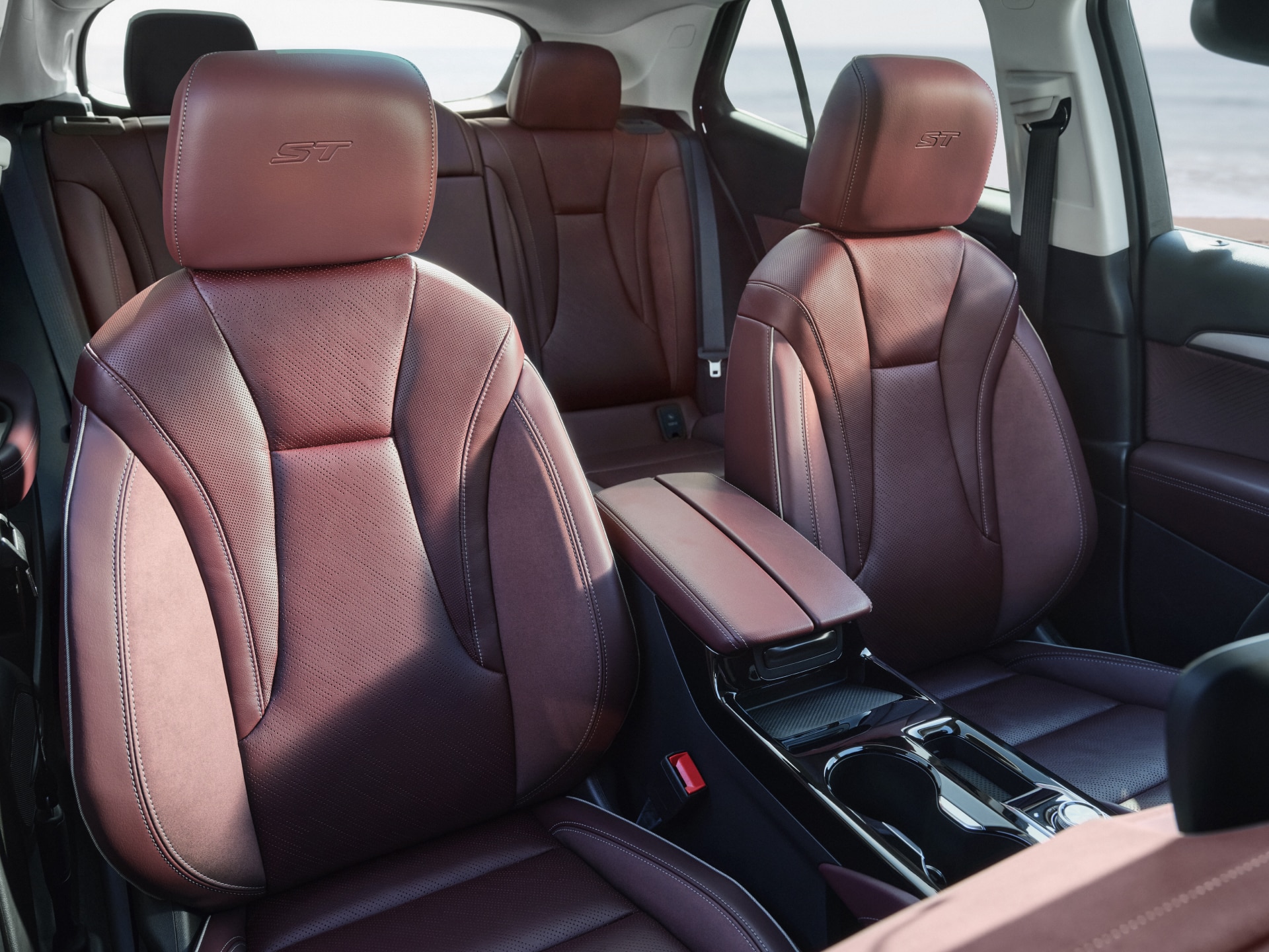 Interior View of the 2027 Buick Envision with Reddish-Brown Leather Seats featuring ST Embroidery on the Headrests