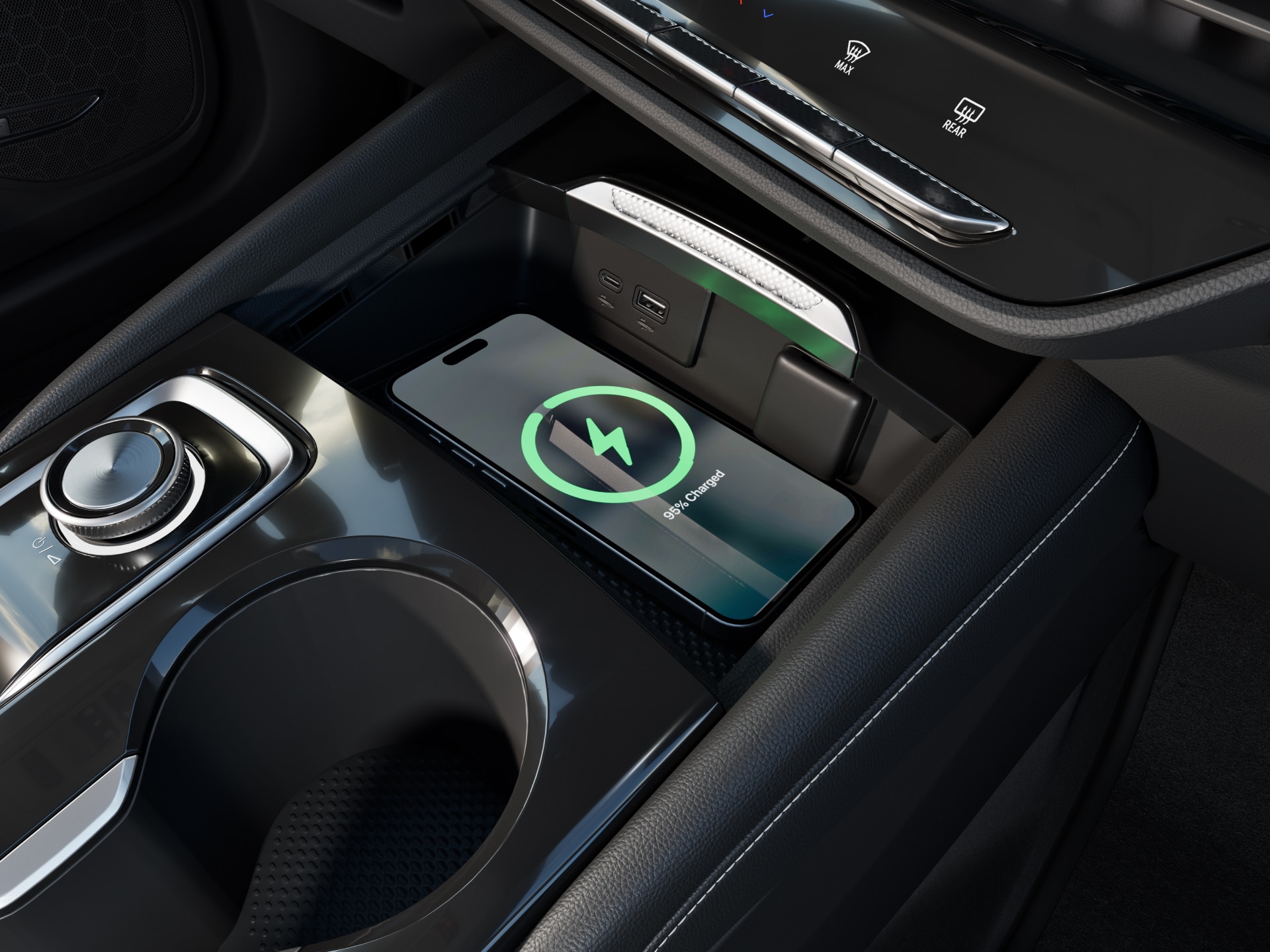 Close-Up of the 2027 Buick Envision Center Console with a Smartphone Wirelessly Charging and Cup Holders