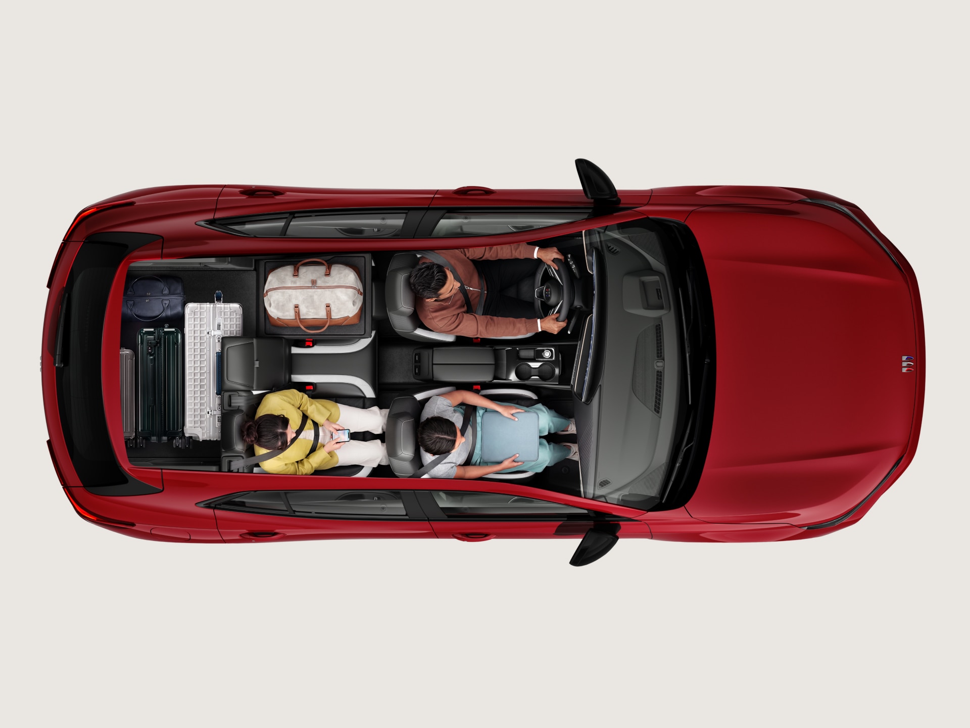 Overhead View of the Red 2027 Buick Envision Interior Showing Three Occupants and Luggage in the Cargo Area