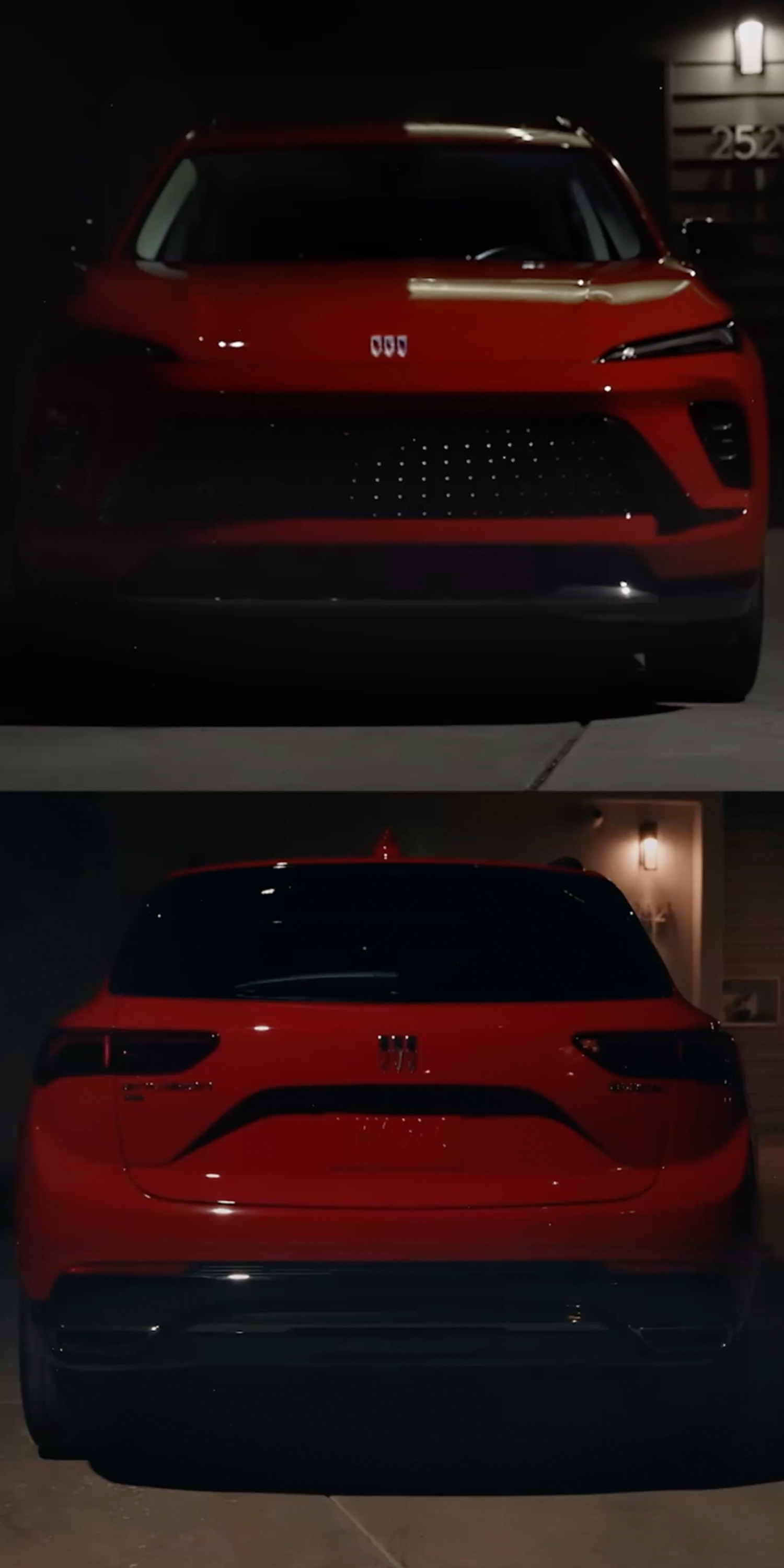 The Front View of a Shiny Red Buick SUV Parked in Front of a Modern Home at Night, Partially Illuminated by the Headlights