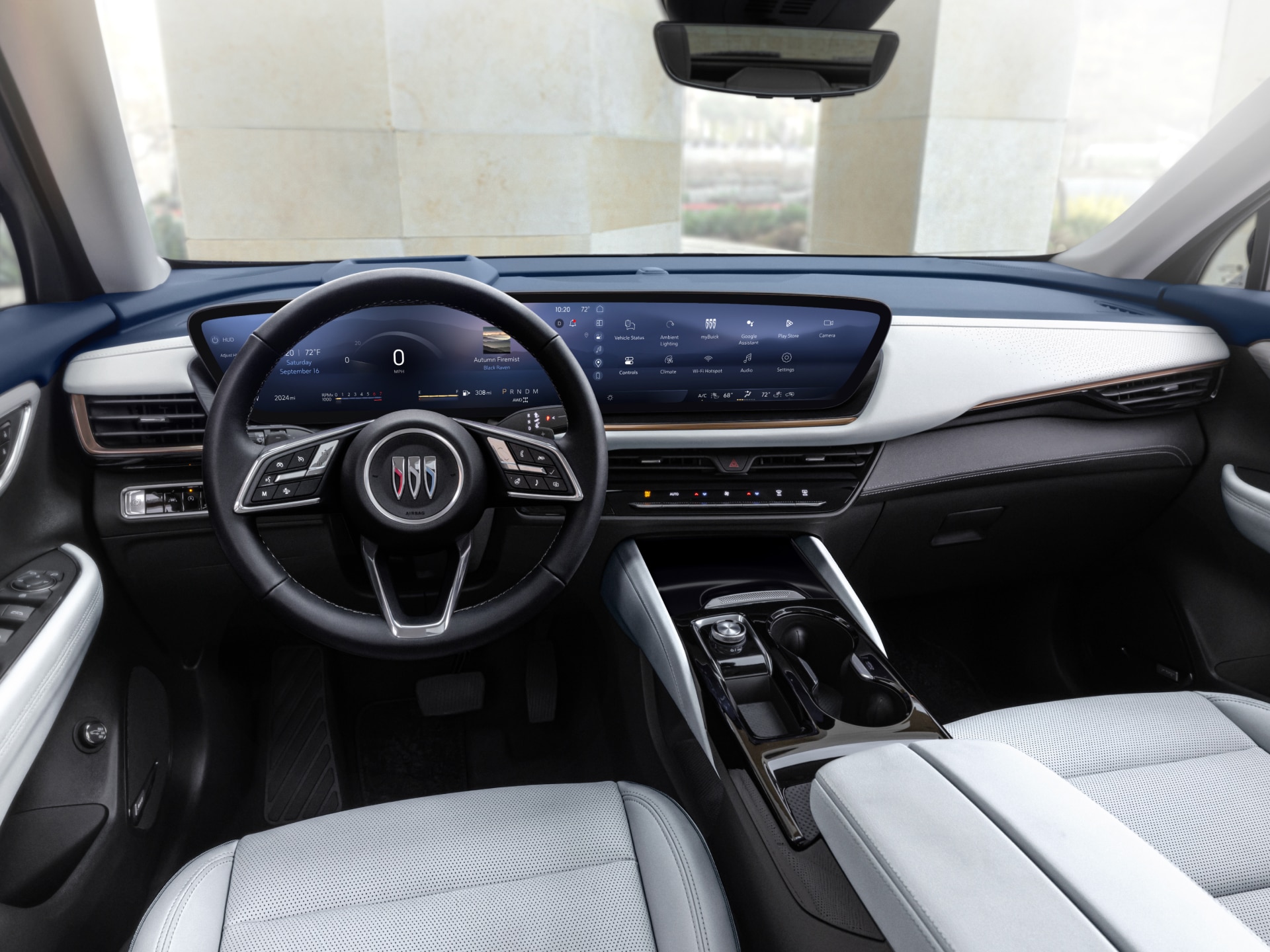 Full Interior View of a Buick Car Dashboard with the Buick Logo on the Steering Wheel and Large Digital Screens