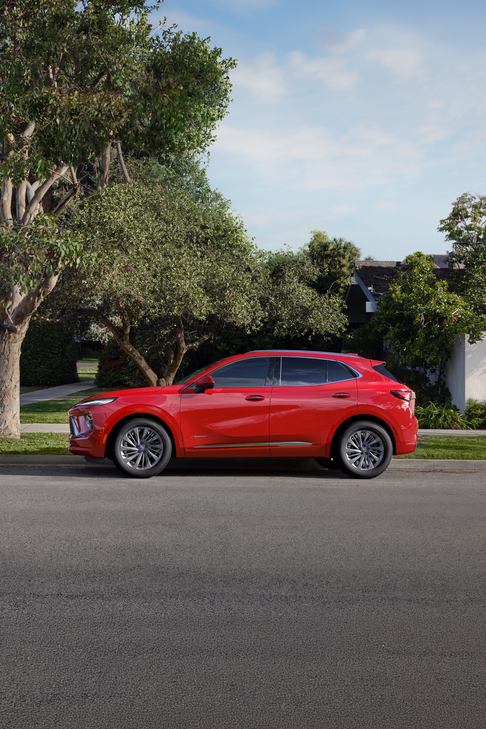 A Red Buick SUV Parked on the Side of a Suburban Street