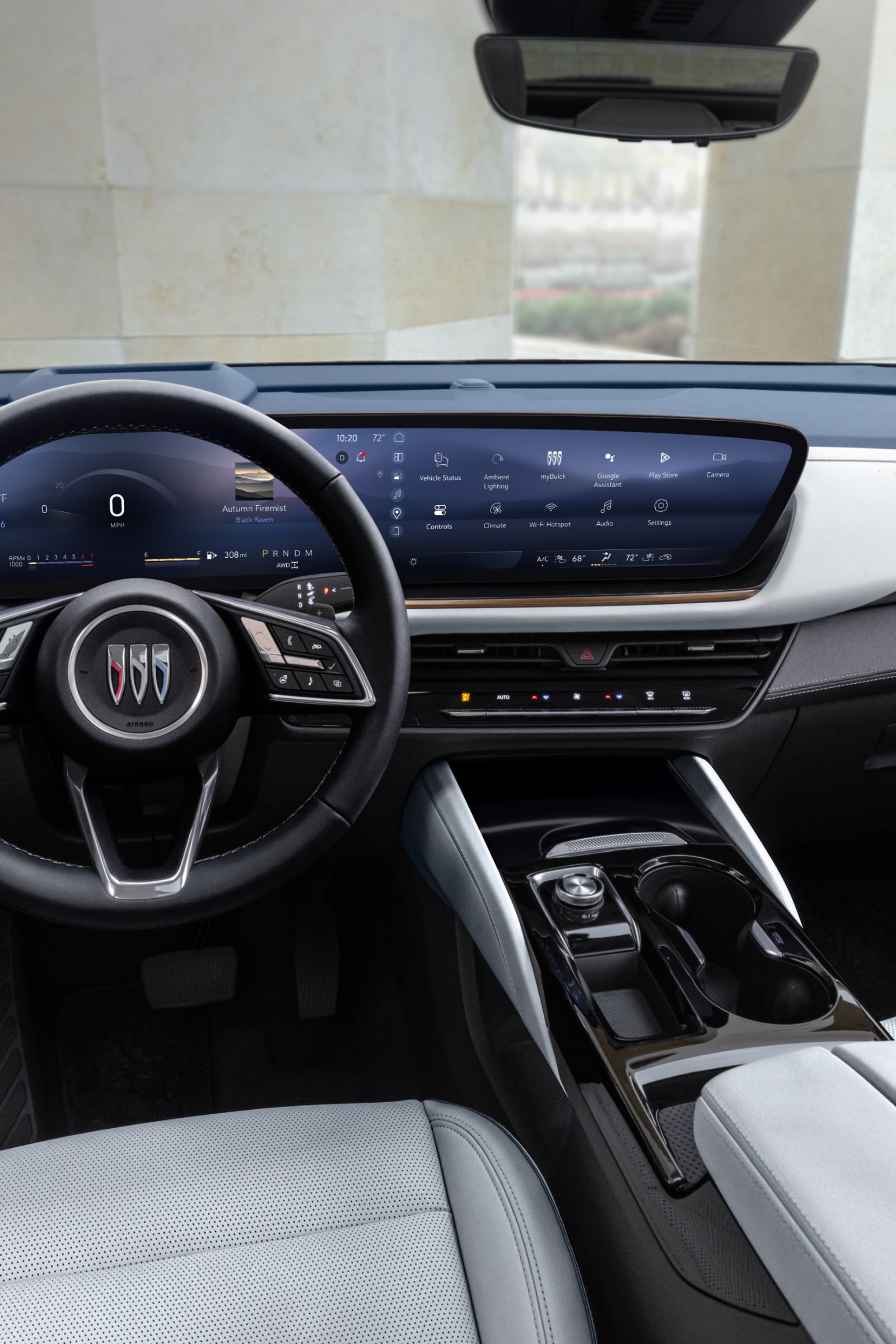 Full Interior View of a Buick Car Dashboard with the Buick Logo on the Steering Wheel and Large Digital Screens