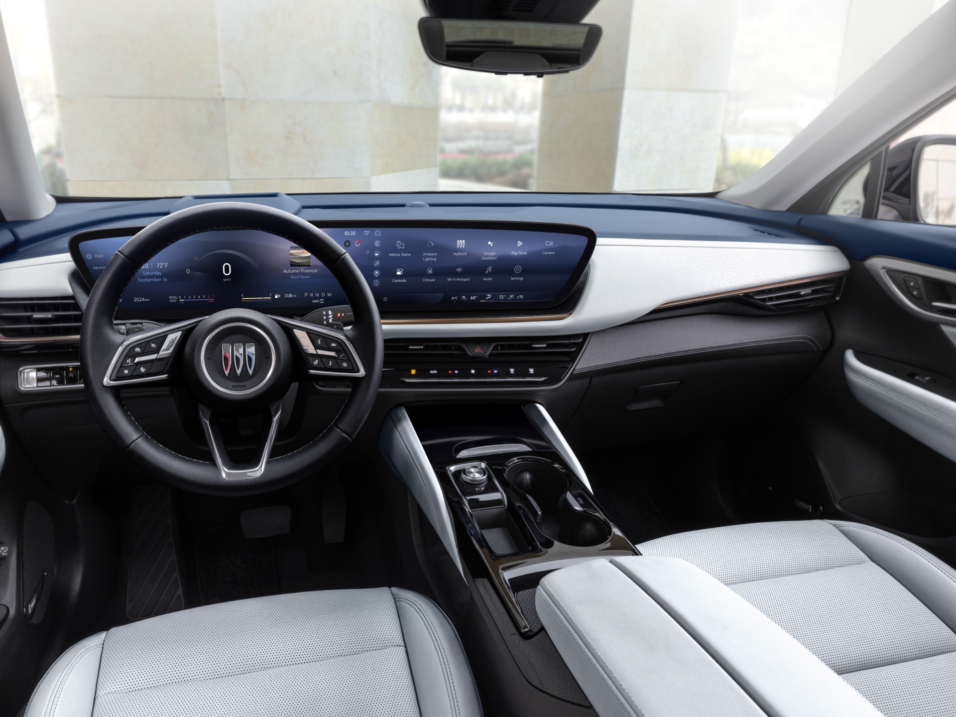 Full Interior View of a Buick Car Dashboard with the Buick Logo on the Steering Wheel and Large Digital Screens